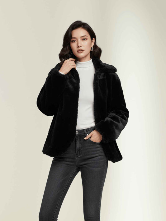 a black faux fur jacket styled with a white high-neck top and dark skinny jeans